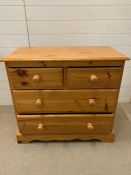 A pine chest of drawers (H77cm W85cm D42cm)