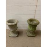 A pair of garden planters with decorative leaves to side (H49cm W34cm)