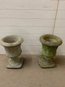 A pair of garden planters with decorative leaves to side (H49cm W34cm)