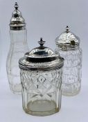 Three hallmarked silver topped glass table items.
