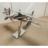 A large chrome decorative plane on stand (H69cm W100cm D110cm)