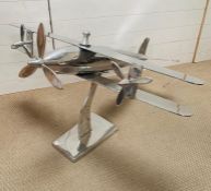 A large chrome decorative plane on stand (H69cm W100cm D110cm)