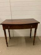 A mahogany hall table with string inlay and one drawer to centre on turned legs (H74cm W92cm D52cm)