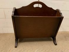 A mahogany magazine rack