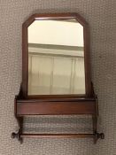 A mahogany shaving wall mirror