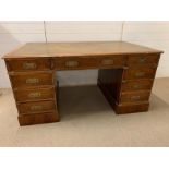 A leather top campaign style desk (H74cm W154cm D87cm)