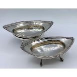 Two silver bowls on ball and claw feet, continental. 177g (15cm long)