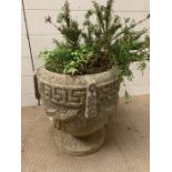 A re-conditioned stone garden planter
