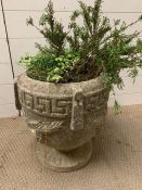 A re-conditioned stone garden planter