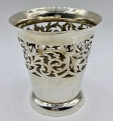 A silver vase, with pierced decoration (74g) hallmarked by William Devenport Birmingham 1902.