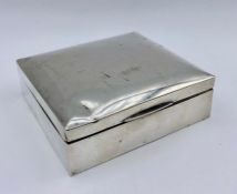 A silver cigarette box