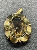 A 9ct gold pendant with smoky quartz stone. (6.6g)