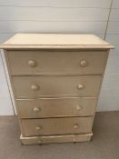 A white painted four drawer chest of drawers with bun handles (H127cm W90cm D50cm)