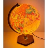 An Illuminated world globe on stand