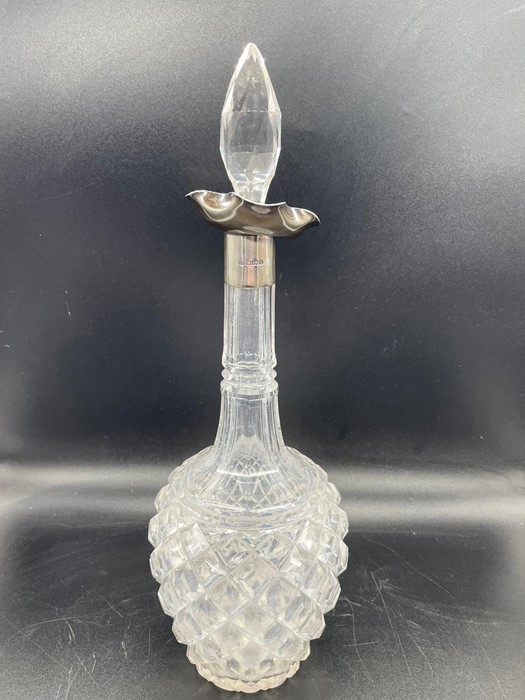 A silver collared cut glass decanter by Cooper Brothers & Sons Ltd