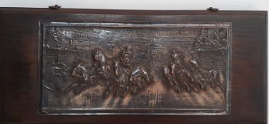 A brass relief on wood depicting a quadrigas race, signed: 'P.King' (after engraving) and dated 1909