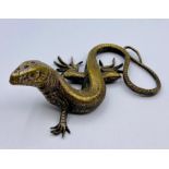 A Brass figure of a lizard