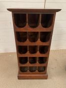 A mahogany wine rack (H80cm W38cm D31cm)