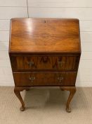 A mahogany bureau with drop front opening to reveal pigeon holes and drawers (H100cm W60cm D40cm)