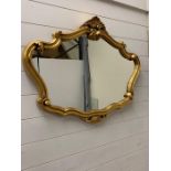 A gilt frame wall mirror with scroll work (90cm x 68cm)