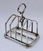 A silver toast rack by Elkington & Co, hallmarked for Birmingham 1922 (9cm x 9cm)