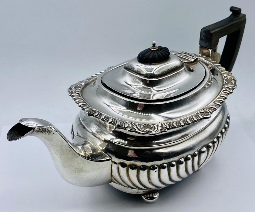 A substantial silver teapot, (Total weight 695g) on four feet, by George Nathan & Ridley Hayes and - Image 2 of 6