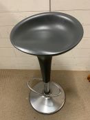 A grey kitchen stool on chrome base