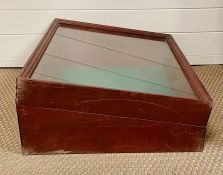 A Lockable glass fold over display cabinet