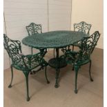 A Garden metal table set with four chairs in green, (137cm Long by 92cm Wide)