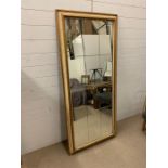 A Mid 19 Century giltwood framed wall mirror with twelve glass panels (H170cm W75cm)