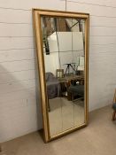 A Mid 19 Century giltwood framed wall mirror with twelve glass panels (H170cm W75cm)