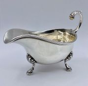 A silver sauce boat on four hoof feet, Reid & Sons, Newcastle On Tyne, hallmarked for London