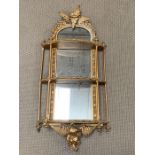 A George II style giltwood wall mirrored shelves with flowers and fern leaves with gilt wood rods to