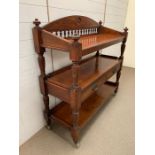 A mahogany serving table on wheels with drawers to front (H120cm W116cm D45cm)