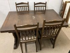 An Ercol dining table with four chairs (H75cm W137cm D84cm)