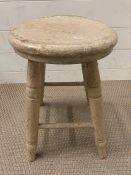 A small oak stool (H46cm Dia 29cm)