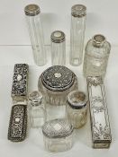 A selection of eleven white metal topped vanity set bottles, jars etc.