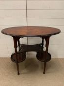 A mahogany oval side table on turned legs (H74cm W84cm D45cm)