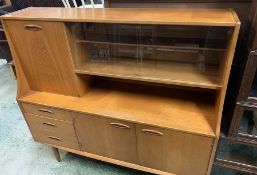 A G-Plan style teak sideboard with glazed shelves (H127cm W138cm D40cm)