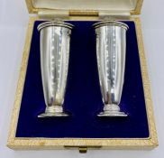 A cased set of David Lawrence silver salt and pepper shakers, hallmarked for Birmingham 1963