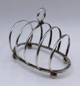 A silver toast rack by George Unite & Sons, hallmarked Chester 1914 (9.5cm x 8cm)