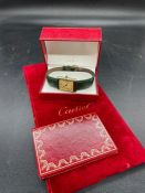 A Vintage Must de Cartier Tank watch in original box with green strap, paperwork confirming