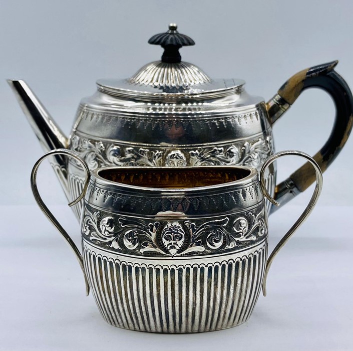 A silver teapot and sugar bowl, hallmarked London 1881, by William Hutton & Sons (Total weight