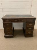 An oak pedestal table with blue leather top AF (H77cm W105cm D60cm)