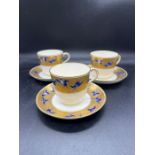 Christopher Dresser for Minton 3 Teacups with Saucers decorated with Blue Glazed flying Cranes in