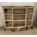 A late Victorian painted oak breakfront open bookcase (H110cm W138cm D39cm)