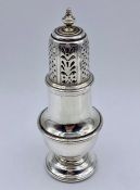 A silver sugar shaker by C S Harris & Sons Ltd, hallmarked London 1915 (12cm tall)