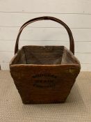 A wooden grain bucket stamped Rodgers Grain company