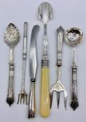 A selection of silver mounted and handled cutlery including stilton scoop