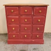 A painted pine chest of drawers with twelve small drawers (H90cm W85cm D36cm)